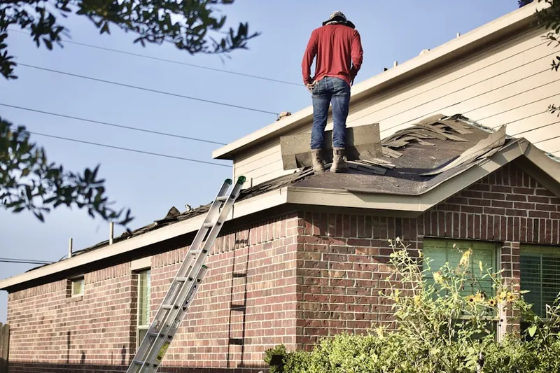 Professional roofer working on a residential roof in Oak Brook